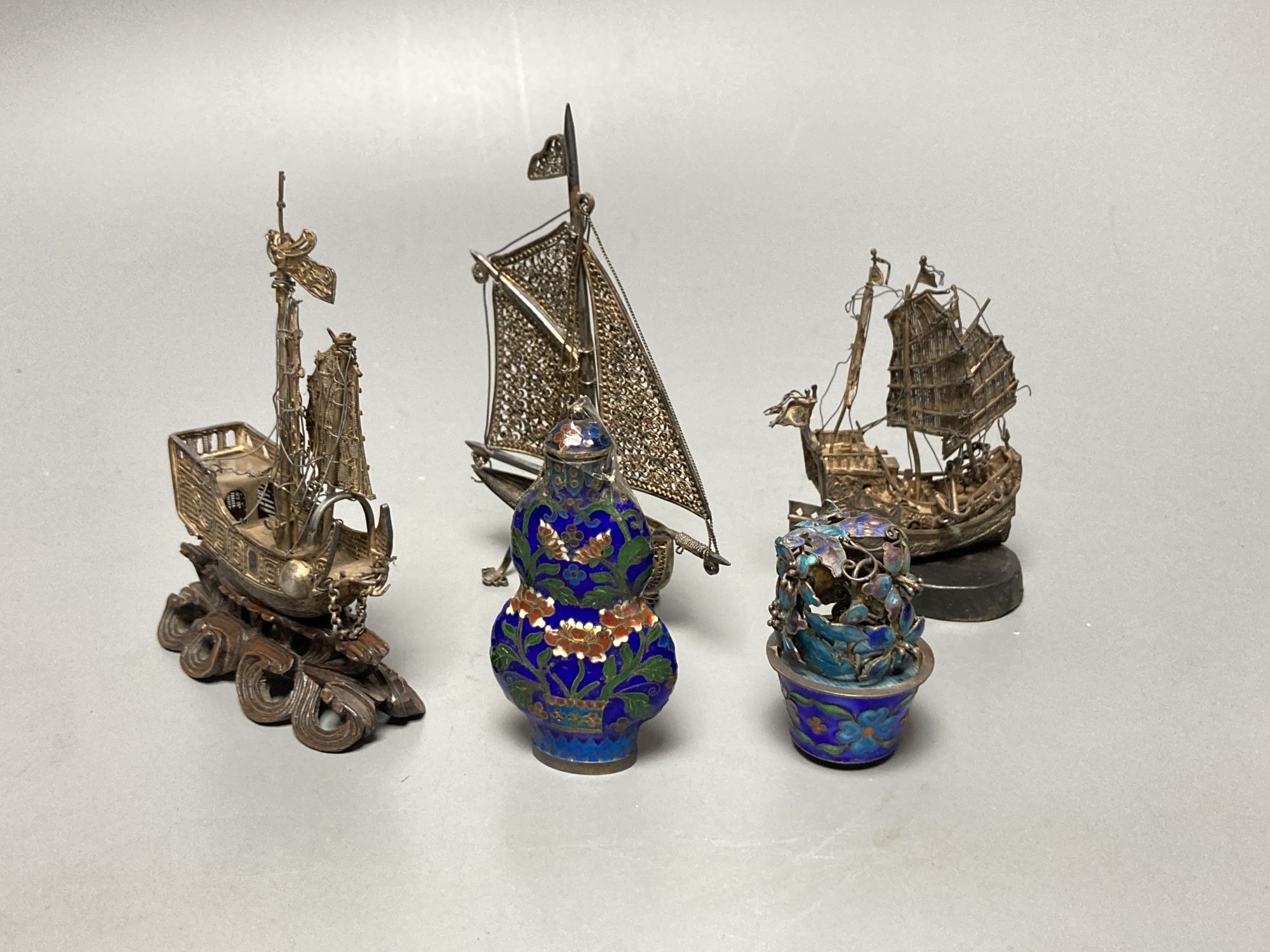 Three filigree boats, an enamelled flower pot and a snuff bottle